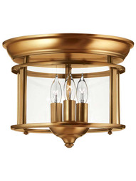 Gentry Flush Mount Ceiling Light With 3 Lights in Heirloom Brass.